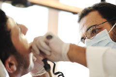 A dentist providing emergency dental care to a patient