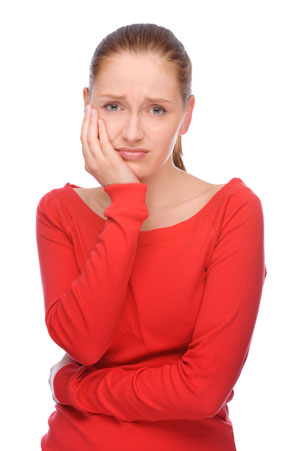 A woman with dental pain from a lost crown